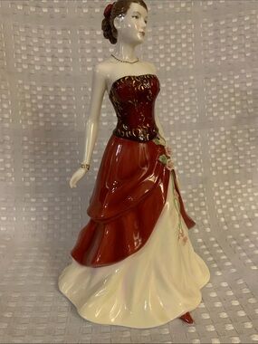 Royal Doulton ‘Emily' from the Pretty Ladies series of figurines. 9 inches tall.